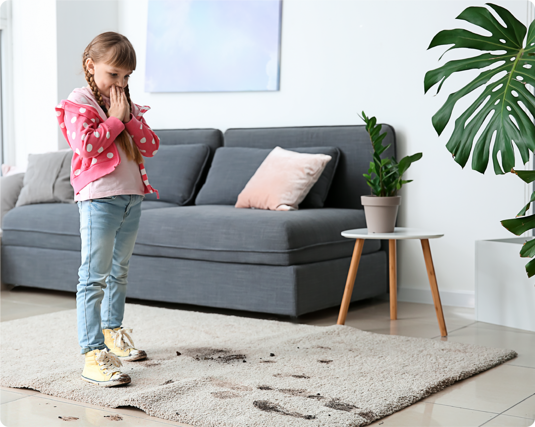 girl with dirty shoe prints on white carpet