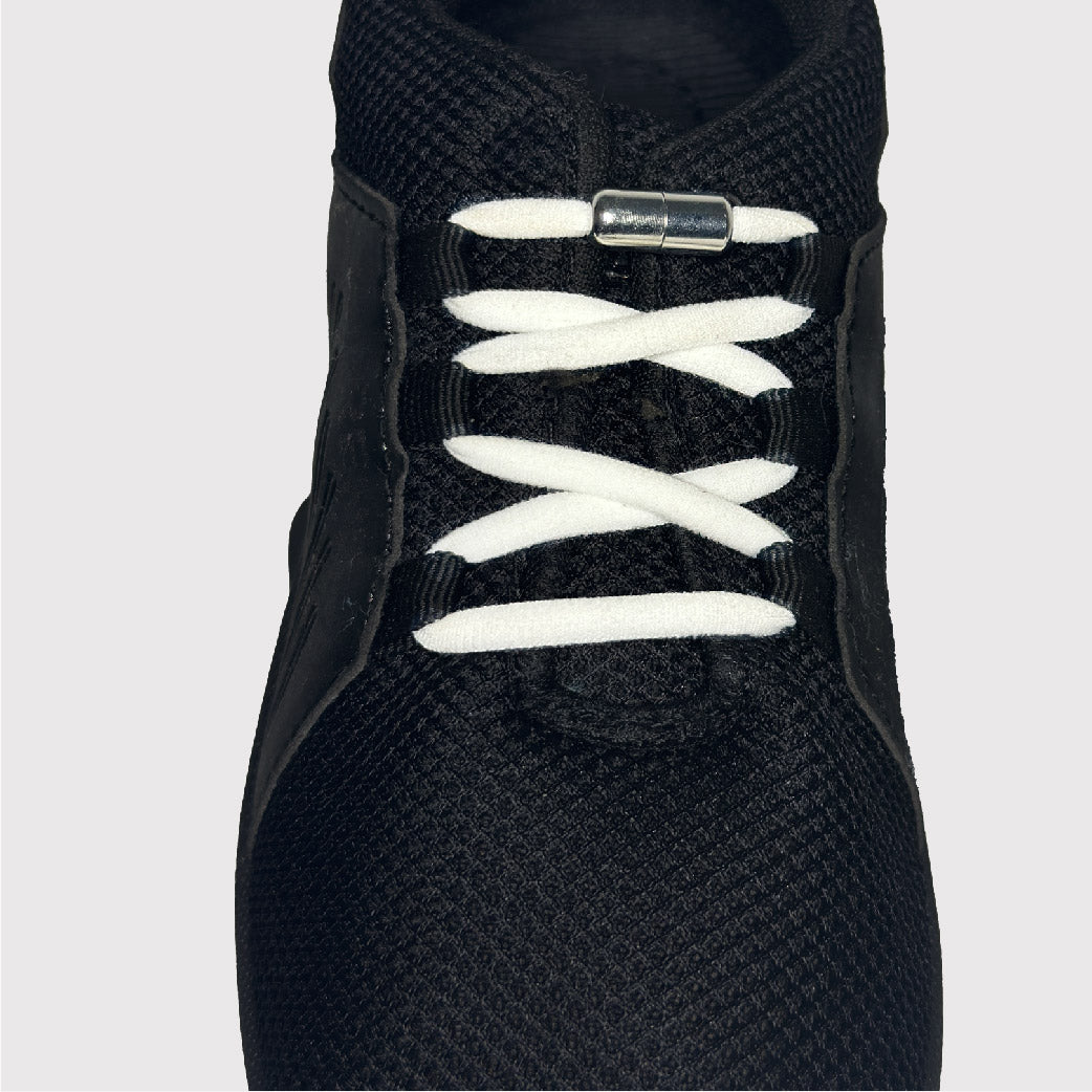 black shoes with white no-tie shoelaces