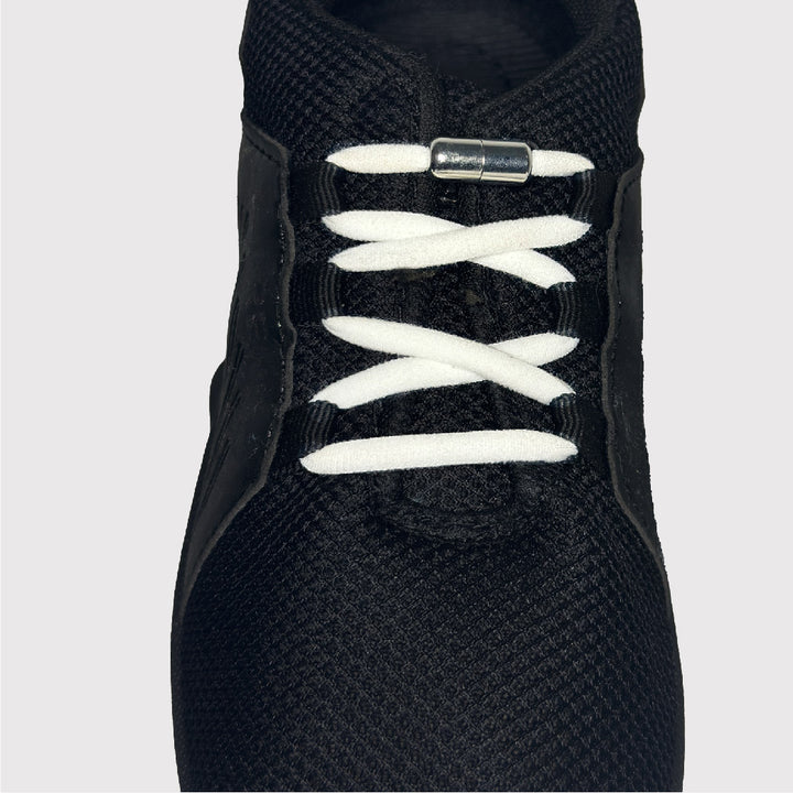 black shoes with white no-tie shoelaces