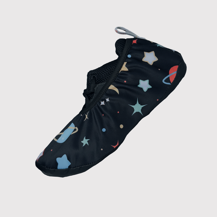 side view of shoe cover, black fabric with planets pattern